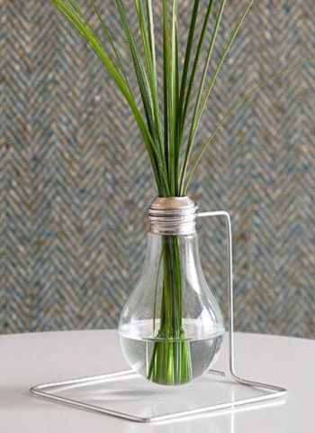 a vase with some flowers in it on a table