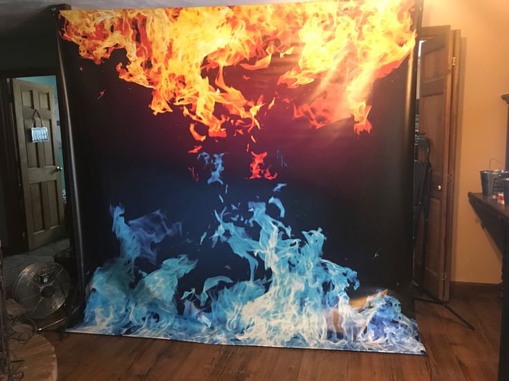 a large fire painting on the side of a wall