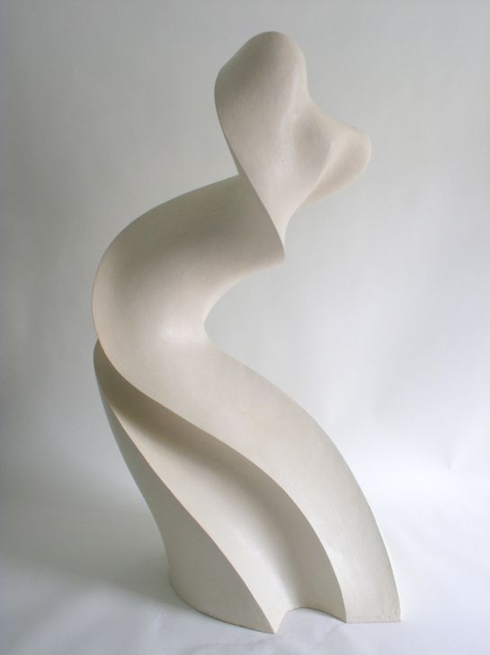 a white sculpture is shown against a white background with the shape of a curved wave