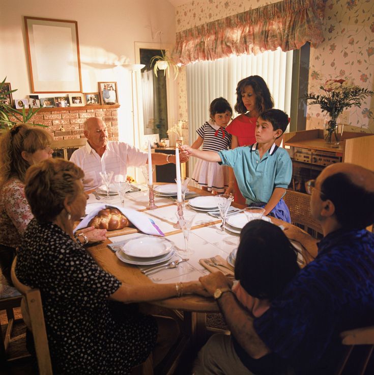 a group of people sitting around a dinner table