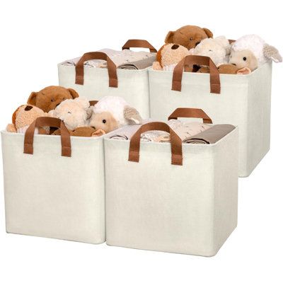 four white bags with brown handles and teddy bears in them, all lined up on top of each other