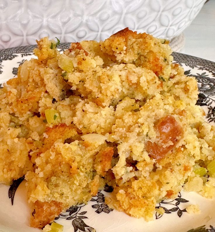 a close up of a plate of food with broccoli and stuffing on it