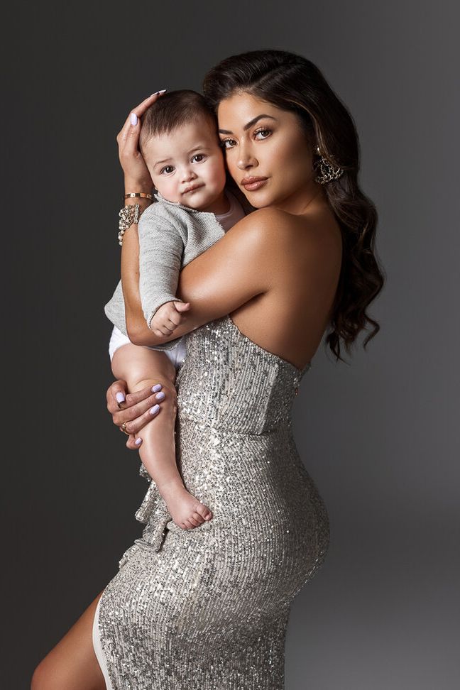 a woman holding a baby in her arms