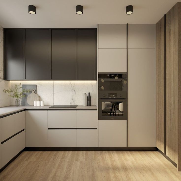 a modern kitchen with white cabinets and wood flooring, along with black appliances on the wall