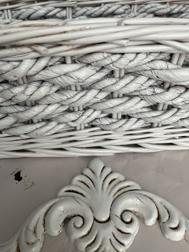 a white wicker basket sitting on top of a table