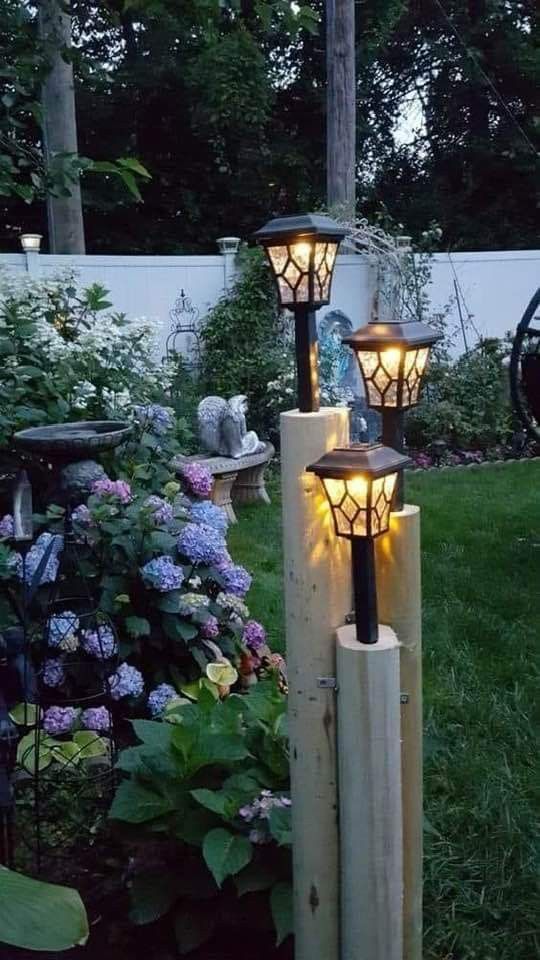 some lights that are sitting in the grass