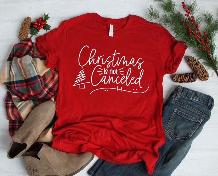 W H A T ' S * I N C L U D E D A super soft shirt with the Christmas is not Canceled design in the following color options: - Canvas Red shirt / White text - Forest shirt / White text - Vintage Black shirt / White text - Leaf shirt / White text - Navy shirt / White text - Military Green shirt / White text - Heather Prism Dusty Blue shirt / Black text M A T E R I A L S Solid Colors: - 100% combed and ring-spun cotton - High quality heat transfer vinyl Heather Prism Colors: - 99% Airlume combed and Canton Tx, Military Green Shirt, Leaf Shirt, Girls Weekend Shirts, Christmas Tee Shirts, Christmas T Shirt Design, Christmas Party Shirts, Girls Trip Shirts, Cute Christmas Tree