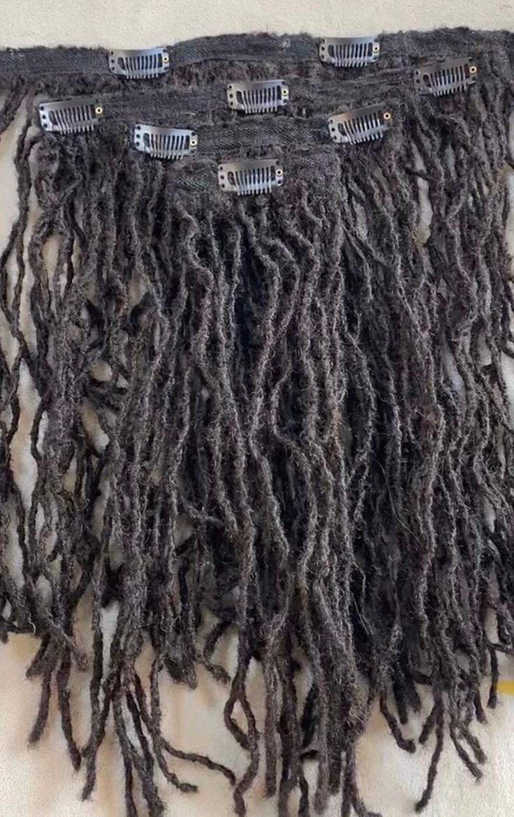 sister loc clip ins  color: 1b length : 18" size .2cm  # of strands: 110  # of clip ins : 4 piece set  we customize also. send us a message.  Use Loc clip ins to achieve your desired styles.  No more having to wait for hair to grow or get  thicker to achieve styles.  If have loss of hair in some areas, try loc clip ins.  Instructions: part your hair, lay the extensions, clip down and lay your locks over the extensions. Style as desired. Locs Maintenance, Ballet Hair Bun, Permanent Dreadlock Extensions, Ballet Hairstyles, Micro Locs, Sister Locs, Hair Tinsel, Hair Twist, Human Hair Clip Ins