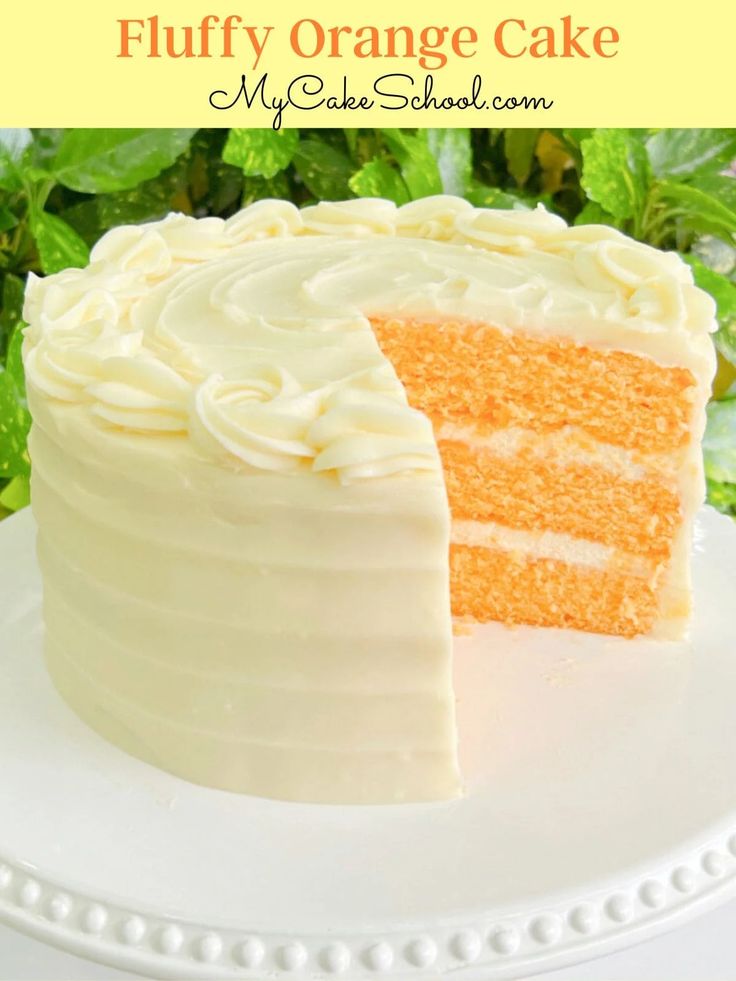 a close up of a slice of cake on a plate with the words fluffy orange cake