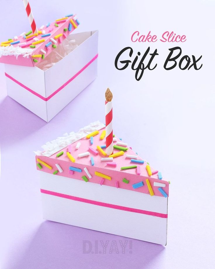 the cake slice gift box is decorated with pink icing and sprinkles