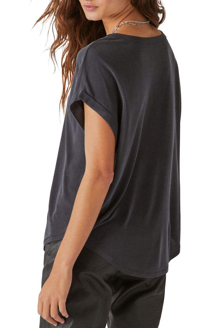 Fall for the drapey look and soft feel of this dolman-sleeve T-shirt punctuated with a curved hem. 23" length (size Medium) Crewneck Short sleeves 72% modal, 28% polyester Machine wash, tumble dry Imported Casual Black Modal Tops, Casual Drapey Tops For Layering, Relaxed Fit Modal Top With Short Sleeves, Slouchy Black Tops For Layering, Slouchy Batwing Sleeve Tops For Layering, Black Slouchy Tops For Layering, Black Scoop Neck T-shirt For Fall, Casual Drapey Top With Batwing Sleeves, Black Relaxed Fit Top In Modal