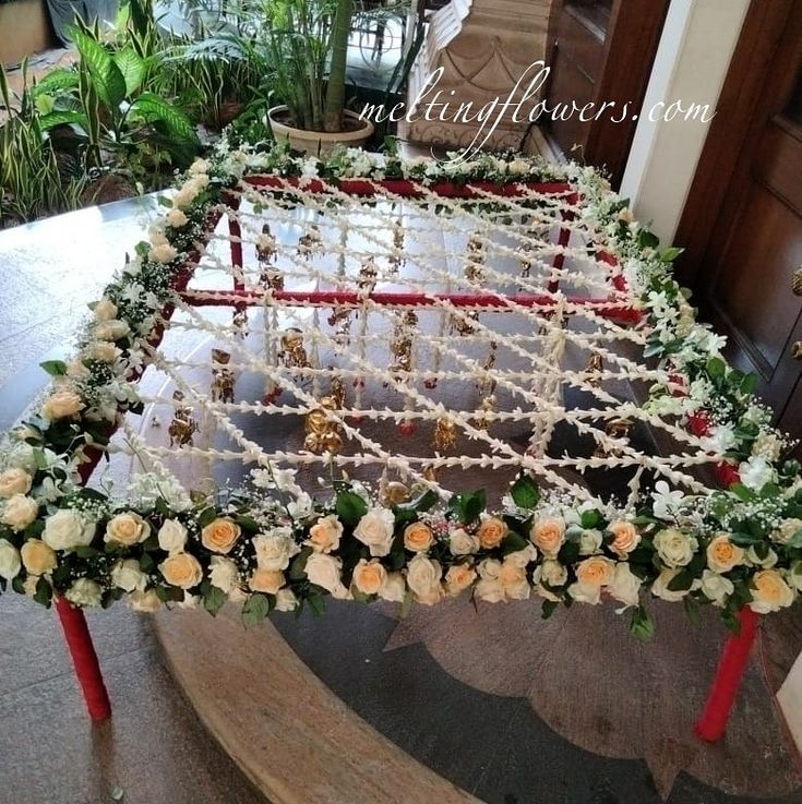 an elaborately decorated table with flowers on it