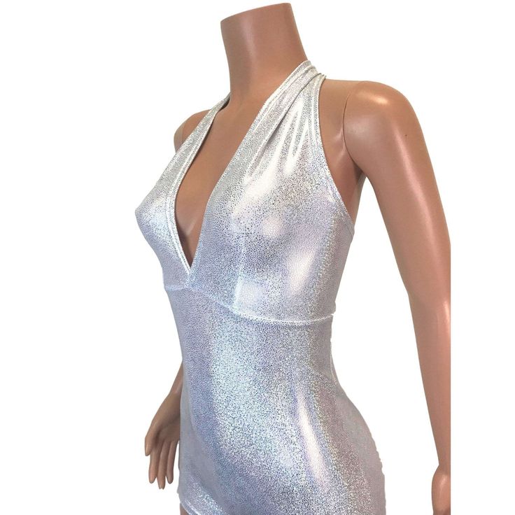 Made of our silver on white holographic spandex, this halter romper hugs the body, but offers plenty of stretch. The halter top ties at the back of the neck. Our seamless front design is extremely comfortable and prevents camel toe. Wear this to a rave, to a festival, or an aerial performance. Glamorous Metallic Halter Top, Shiny Summer Bodysuit For Club, Metallic Sleeveless Halter Top For Night Out, Silver Halter Top For Summer Night Out, Silver Sleeveless Bodysuit For Party, Silver Sleeveless Halter Top For Night Out, Silver Halter Top For Summer Nights, Silver Sleeveless Party Bodysuit, Silver Sleeveless Halter Top For Summer