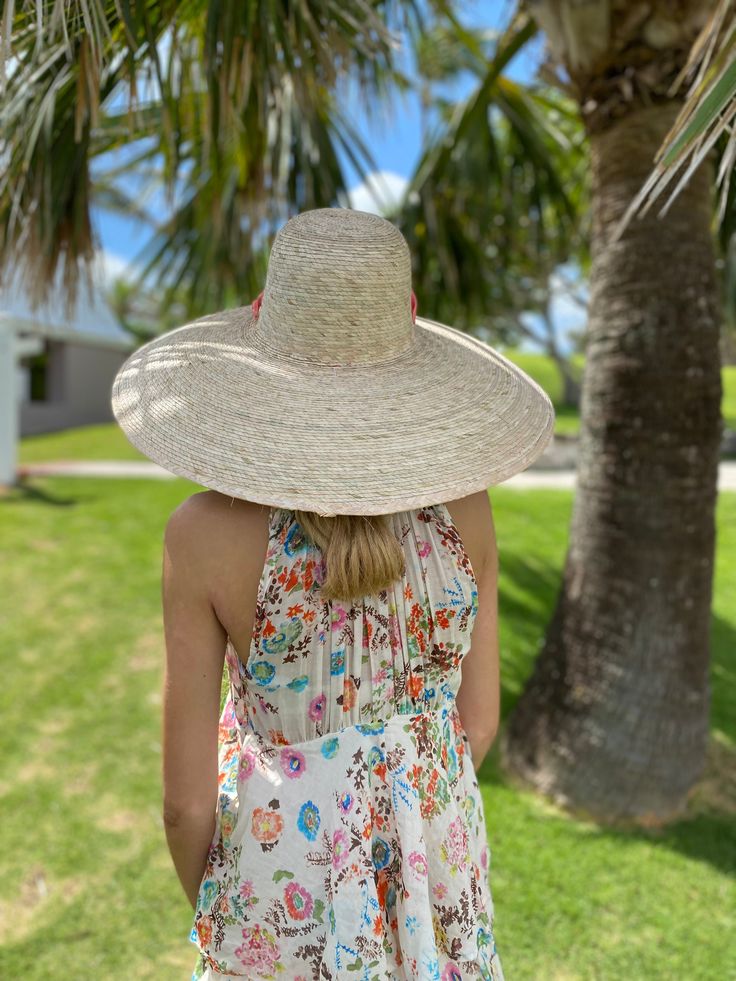 This super wide-brimmed hat will glamorously shield you from the sun! Crown Circumference: 23.5 inches (when measured on the outside of the hat). There is an interior elastic band with a circumference that is about 22 inches, with slight variability due to the fact that these are handmade. Brim Length: 7 inches (18 cm) Crown Height: 4 3/4 inches (11.5 cm) This hat ships with a long ivory grosgrain ribbon. NATURAL MATERIAL: This hat is woven with real palm tree leaves, so there is natural color d Adjustable High Crown Sun Hat For Vacation, High Crown Straw Hat For Summer Vacation, Summer Vacation High Crown Straw Hat, Summer Beach Boater Hat With High Crown, Toquilla Straw High Crown Hat For Summer, Summer High Crown Boater Hat For Beach, Natural High Crown Straw Hat For Beach, Natural High Crown Straw Hat For Vacation, High Crown Toquilla Straw Hat For Summer