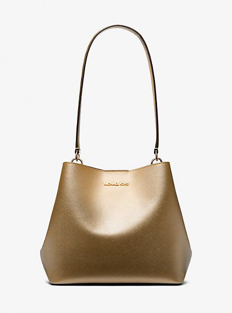 From its bucket-inspired shape to its textured metallic finish, the Pratt is a handbag that will stand the test of time. A coated-canvas exterior promises lasting wear, while on the inside, a spacious interior with a median zip pocket ensures easy organizing. Slip the long, slender straps over your shoulder for hands-free wear. Michael Kors Outlet, Easy Organization, Pale Gold, Handbags On Sale, Hands Free, Zip Pockets, Dust Bag, Michael Kors, Bag Lady