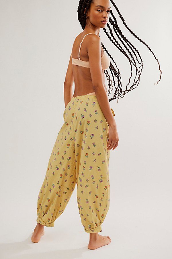 Inspired by our Sunday Morning Boxer Shorts, these laidback lounge pants are featured in a soft cotton fabrication and slouchy silhouette with faux button detailing and rolled hemlines. **Fit:** Slouchy, relaxed fit; mid-rise, ankle-length style **Features:** Soft cotton fabrication, smocked elastic waistband, faux button detail, pockets for hands, rolled hemlines with cinched detail **Why We ❤ It:** These effortlessly easy pants can be pulled on with your favorite cami for the perfect lounge-re Cotton Harem Pants With Elastic Waistband For Loungewear, Trendy Cotton Bottoms For Loungewear, Baggy Sweatpants For Spring Loungewear, Trendy Cotton Loungewear Bottoms, Casual Sweatpants For Pajama Party In Spring, Casual Spring Sweatpants For Pajama Party, Cotton Bottoms For Lounging With Loose Fit, Cotton Bottoms For Lounging With Loosely Fitted Hips, Comfortable Spring Harem Pants For Loungewear