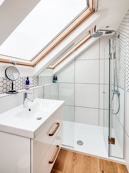 a bathroom with a skylight above the sink