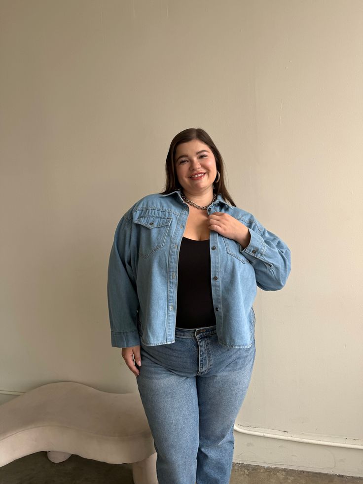 Enjoy a classic with the new Plus Size Oversized Denim Shirt. Made out of denim for a timeless look, this oversized shirt is detailed with two pockets to give it an effortless and timeless appeal. Perfect for casual days and stylish nights, this is definitely a must-have item! This soft denim top features buttons down the front, a folded-down collar, two breast pockets, long sleeves, and a full-length. The material is a super soft denim. This top is made out of 100% Cotton. Imported. Hand wash c Casual Denim Shacket For Everyday, Casual Medium Wash Shacket For Everyday, Casual Denim Shacket With Relaxed Fit, Casual Relaxed Fit Denim Shacket, Trendy Denim Blue Shacket For Everyday, Casual Button-up Medium Wash Shacket, Casual Light Wash Relaxed Fit Shacket, Casual Light Wash Shacket With Relaxed Fit, Oversized Denim Button-up Tops