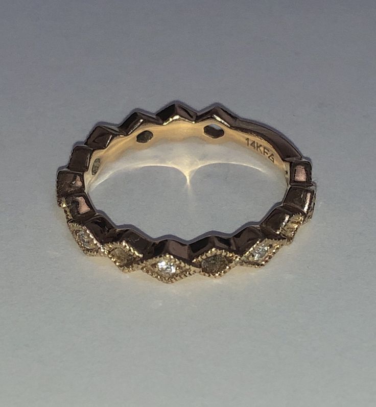 Beautifully vintage. Solid 14K Yellow Gold Diamond Ring. Eternity Band. Beaded detail Marquise design with natural, round cut Diamonds. Sizing bar in back. Stamped 14K and designer's hallmark. Great alone or stacked. Ring size approximately 5.25 - 5.5. Classic Jewelry Ring With Decorative Band, Heirloom Stackable Diamond Ring For Anniversary, Diamond Jewelry With Decorative Round Band, Round Diamond Jewelry With Decorative Band, Diamond Jewelry With Decorative Band For Anniversary, Luxury Jewelry With Decorative Round Cut Band, 14k Gold Marquise Cut Stackable Diamond Ring, Diamond Eternity Band With Decorative Details For Anniversary, Vintage 14k Gold Stackable Jewelry