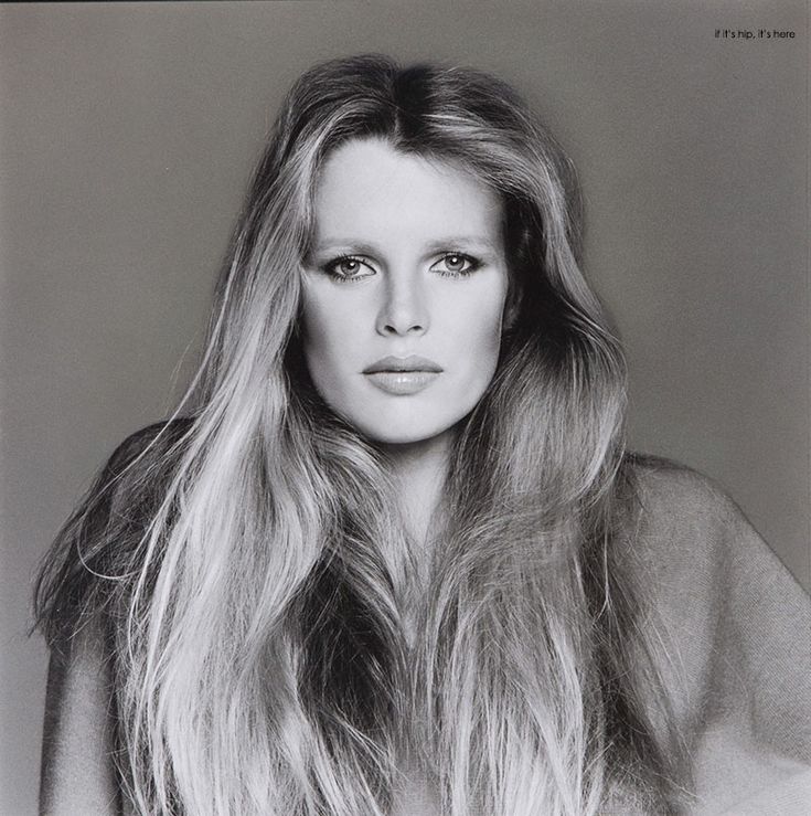 a black and white photo of a woman with long hair