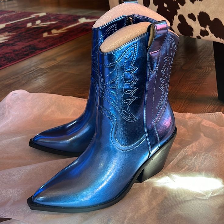 These Are A Gorgeous Metallic Blue Brand New Pair Of Boots By Corkys! They Are A Size 7 And From A Smoke Free Home. I Have The Taller Version Also!! Thanks For Looking!! Blue Western Boots For Summer, Blue Snip Toe Boots With Reinforced Heel, Western Style Blue Boots With Reinforced Heel, Trendy Blue Summer Boots, Blue Western Boots With Almond Toe, Blue Western Almond Toe Boots, Blue Ankle Boots For Party, Trendy Blue Ankle Boots, Casual Blue Pointed Toe Boots