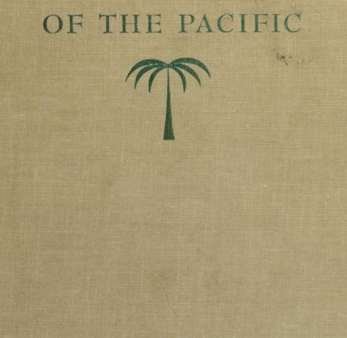 an old book with green lettering on the front and back cover, which has a palm tree