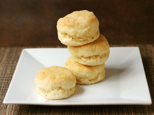 three biscuits stacked on top of each other on a white plate