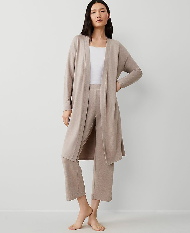 Wrap yourself in the epitome of comfort and style with the Ann Taylor Shawl Collar Duster. This piece is perfect for both indoor relaxation and refined outdoor gatherings.

- **Size:** Medium
- **Color:** Driftwood Heather
- **Material:** 48% Rayon, 48% Acrylic, 4% Spandex
- **Length:** 40 inches long
- **Gender:** Female
- **Care Instructions:** Machine Washable

Crafted with a luxurious blend of rayon, acrylic, and spandex, this duster features a cozy shawl collar and an open front design that Cozy Fall Outerwear For Relaxation, Cozy Outerwear For Spring Lounging, Cozy Spring Outerwear For Lounging, Cozy Spring Lounging Outerwear, Elegant Open Front Loungewear Outerwear, Elegant Open Front Outerwear For Loungewear, Beige Open Front Sweater Coat For Loungewear, Relaxed Fit Wrap Outerwear For Loungewear, Spring Relaxed Fit Sweater Coat For Loungewear