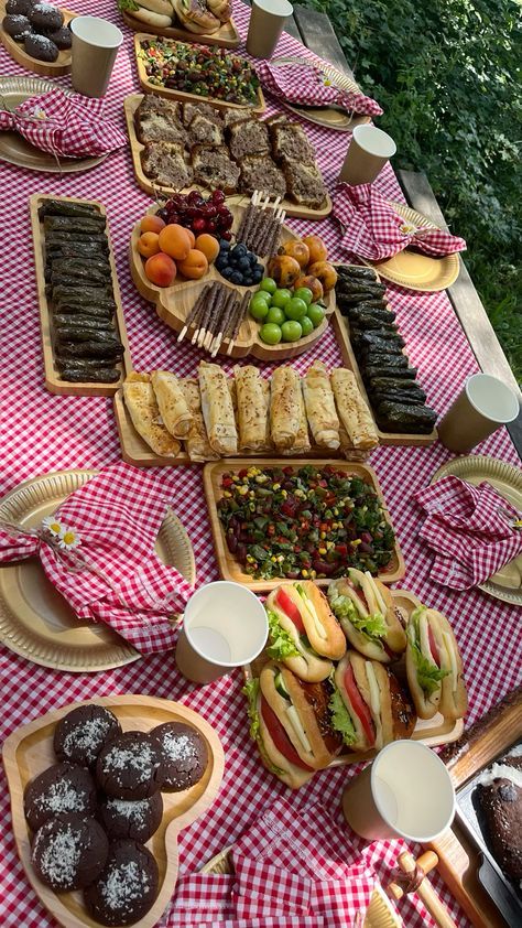 a table topped with lots of food and desserts