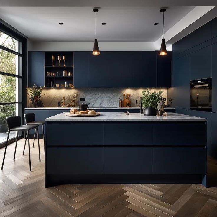 a modern kitchen with dark blue cabinets and wood flooring, along with an island in the middle