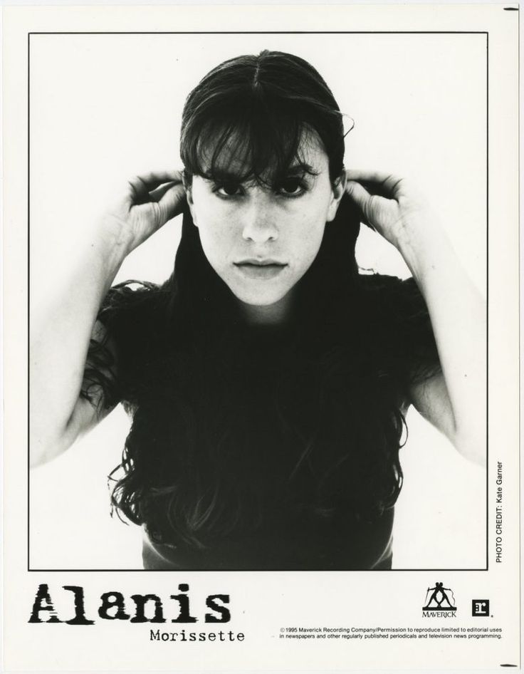 a black and white photo of a woman with her hands on her head