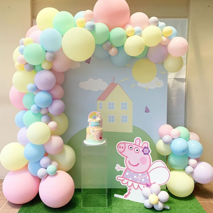 a peppa pig themed birthday party with balloons