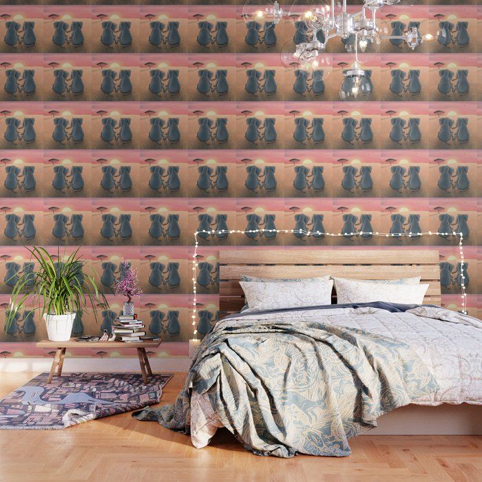 a bedroom with a bed, chandelier and wallpaper that has an image of two cats on it