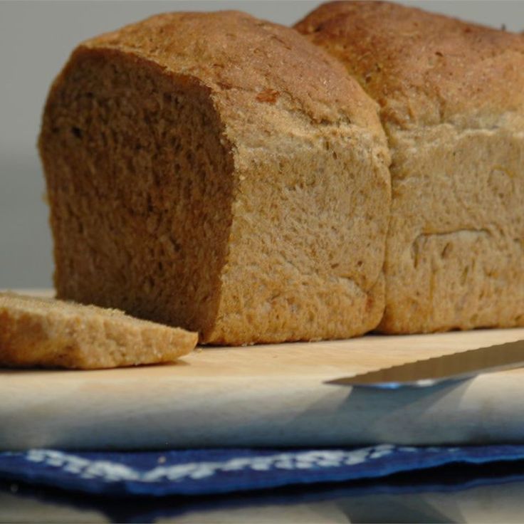 a loaf of bread sitting on top of a cutting board