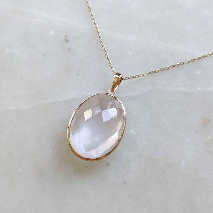 ITEM DESCRIPTION: >>The pendant is made from Solid 14K Yellow Gold. Gemstone used is absolutely natural and ethically sourced. >>Natural Rose Quartz in oval shape with bezel setting is studded on it with utmost precision. >>This is a minimalist design and is absolutely hassle-free and everyday jewelry. Gem: Rose Quartz Gem size: 16x22 mm Gem weight: 14.85 carats Gold purity: 14K (58.33% approx.) Gold weight: 0.58 grams Gross weight: 3.55 grams The Gold purity is guaranteed and it comes with auth Pink Oval Jewelry With Bezel Setting, Pink Oval Bezel Set Jewelry, Oval Rose Gold Jewelry With Birthstone, Oval Rose Cut Diamond Jewelry In Rose Gold, Rose Gold Oval Jewelry With Bezel Setting, Oval Rose Gold Jewelry With Bezel Setting, Elegant Rose Gold Jewelry With Oval Cabochon, Rose Gold Oval Cabochon Jewelry For Anniversary, Gold Necklace Pendant