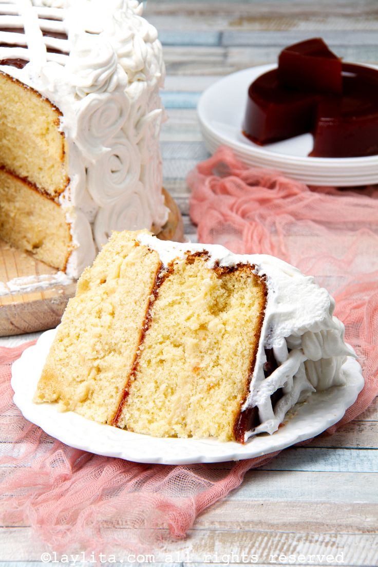 a slice of cake sitting on top of a white plate next to another piece of cake