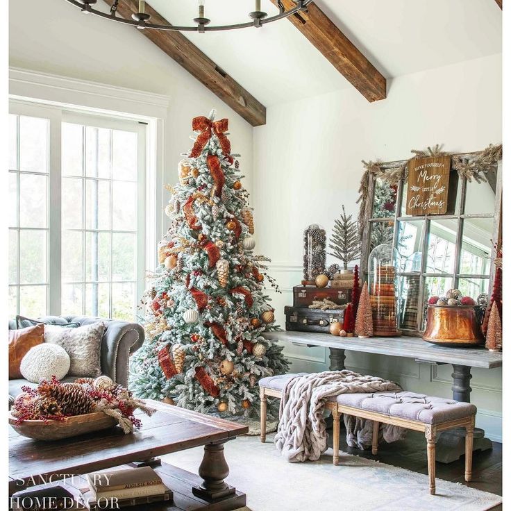 a living room with a christmas tree in the corner and other decorations on the table