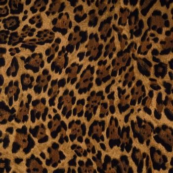 an animal print fabric with brown and black spots on it's fur, showing the pattern