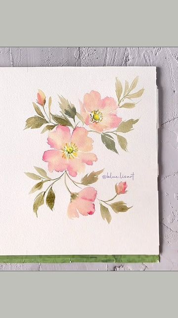 a white card with pink flowers on it