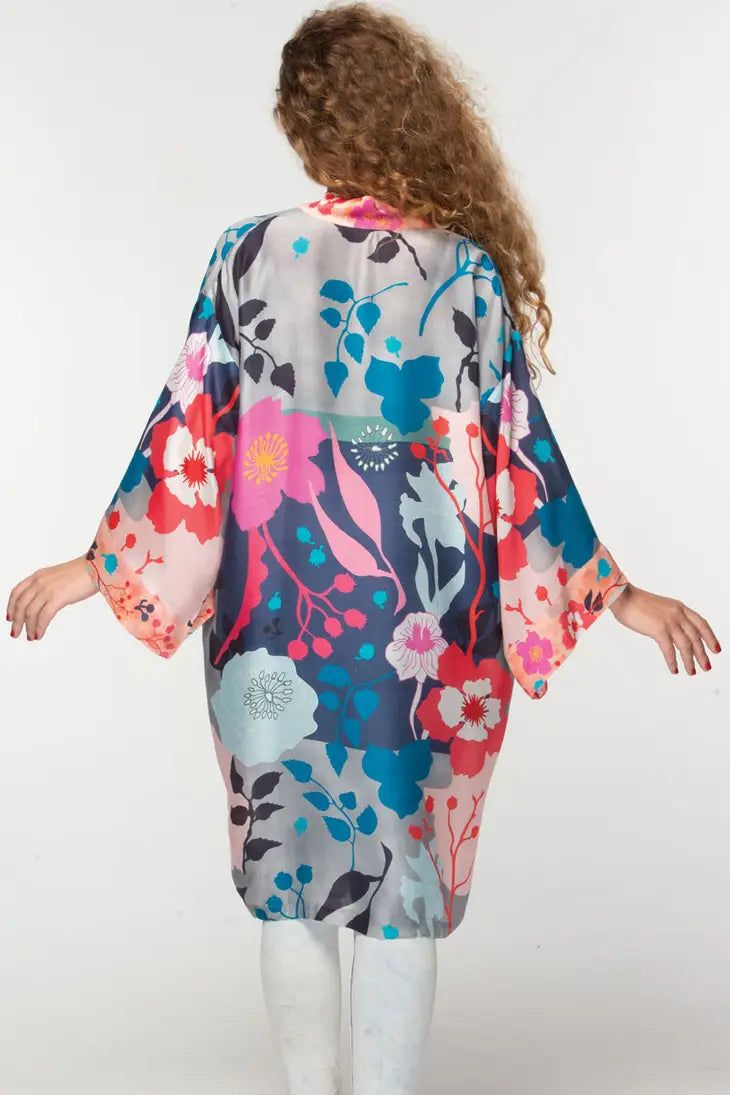 This elegant Malini kimono, by our friends at Sevya Handmade, is crafted with 100% Cupro material for a luxurious yet sustainable option. Its lightweight, breathable composition gives it a similar silk-like feel while significantly reducing care needs. Free-size designed with a floral pattern, this fair-trade garment will provide you with long-lasting comfort. Sevya, derived from Sanskrit, translates to "caring through service". Dedication to preserving India's unique arts and cultures is shown Silk V-neck Kimono For Daywear, Spring Silk Wrap Robe, Spring Silk Kimono For Daywear, Silk Wrap Kimono For Daywear, Silk Sleepwear With Floral Print For Spring, Silk Floral Print Sleepwear For Spring, Silk Kimono With Floral Print For Loungewear, Silk Wrap Kimono, Silk Wrap Kimono For Loungewear