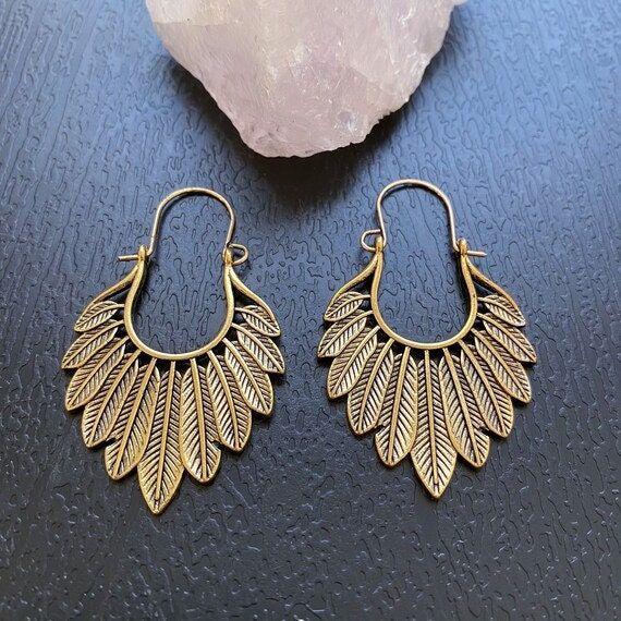 Gold feathered earrings, Boho hoop earrings, Large feather shaped earrings, Antique golden leaf hoops, Bohemian tribal earrings ❤️Boho your way! Thanks for stopping by! We have many unique items here, please take a moment to visit! -Your order will be shipped out within 2 business days after the order has been received. -These earrings are light weight and easy to wear, perfect for your daily look. -They're designed with different geometric shapes like circle, triangle, diamond, teardrop etc, they can show your personality in different styles. -These earrings are also perfect gifts for friends and families, the exquisite accessory for women.  -They fit all of your fashion needs, for any formal and informal occasions, such as party, vacation, prom, wedding, birthday and anniversary, holiday Bohemian Brass Leaf Jewelry, Bohemian Leaf-shaped Brass Jewelry, Bohemian Nickel-free Leaf-shaped Earrings, Bohemian Leaf-shaped Jewelry With Ear Wire, Vintage Gold Hoop Earrings For Summer, Bohemian Feather Earrings For Festivals, Adjustable Gold Feather Earrings, Summer Brass Hoop Earrings For Pierced Ears, Bohemian Leaf-shaped Metal Earrings