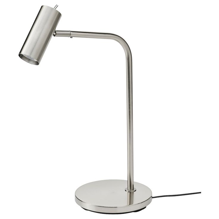 a metal table lamp on a white surface with a cord attached to the base and one light turned on