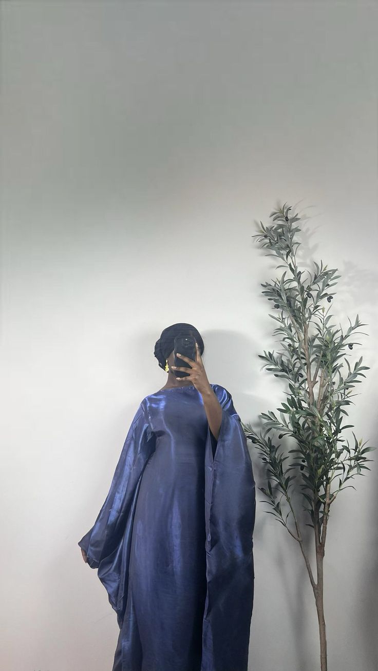 Shiny Butterfly Dress with a sewed in belt, you can decide to tie the belt or wear it loose for a more modest fit. Butterfly Abaya, Shiny Butterfly, Purple Bridesmaids, Modest Fits, Fake Piercing, Abaya Dress, Butterfly Dress, Grad Dresses, Eid Collection