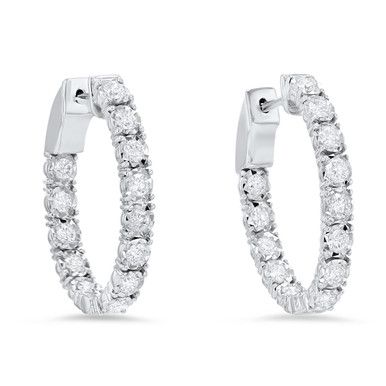 This elegant pair of oval-shaped inside out hoop earrings showcases 1.51 carats of round brilliant cut diamonds, detailed by an intricate illusion setting. They measure approximately 0.75 inches. Luxury Diamond Jewelry With Lever Back Ear Wires, Oval Hoop Earrings With Diamond Accents For Formal Events, Formal Oval Hoop Earrings With Prong Setting, Oval Brilliant Cut Hoop Earrings For Formal Events, Oval Hoop Earrings With Brilliant Cut For Formal Occasions, Classic Oval Hoop Earrings With Prong Setting, Oval Hoop Earrings With Diamond Accents For Formal Occasions, Oval Brilliant Cut Hoop Earrings For Wedding, Oval Hoop Earrings With Brilliant Cut For Wedding