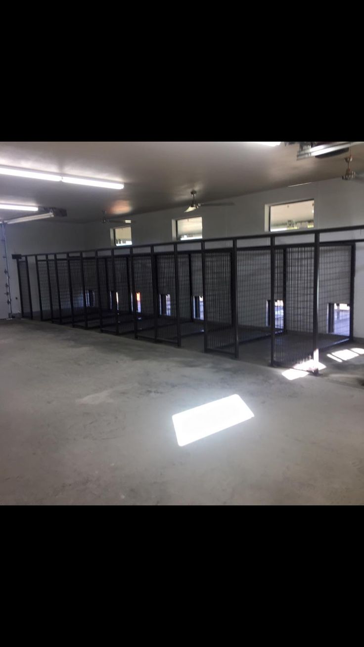 an empty parking garage with lots of doors