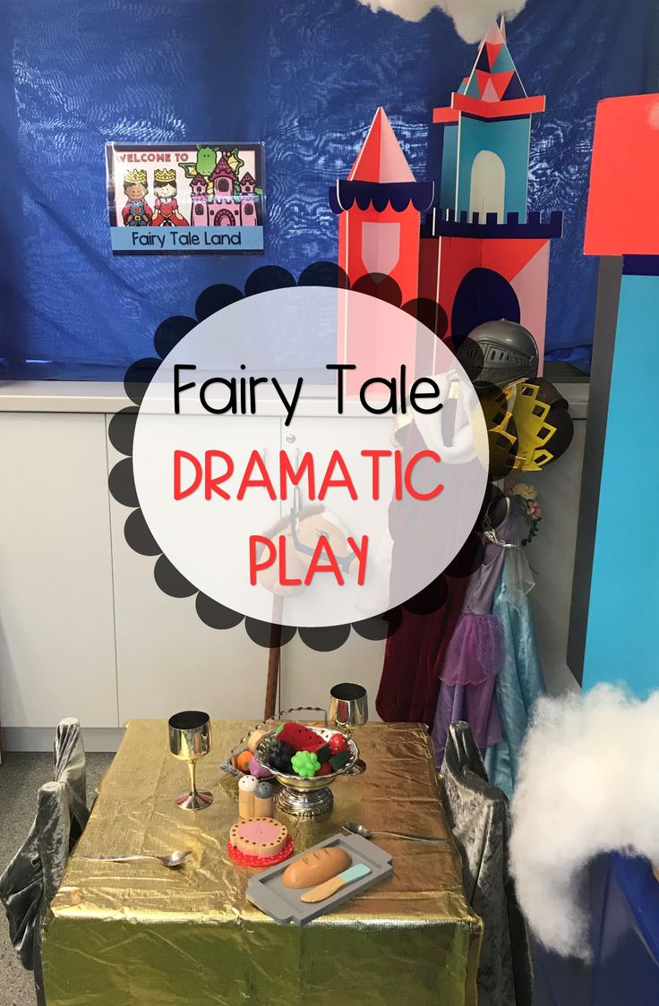 a fairy tale dramatic play with lots of toys and decorations on the table in front of it