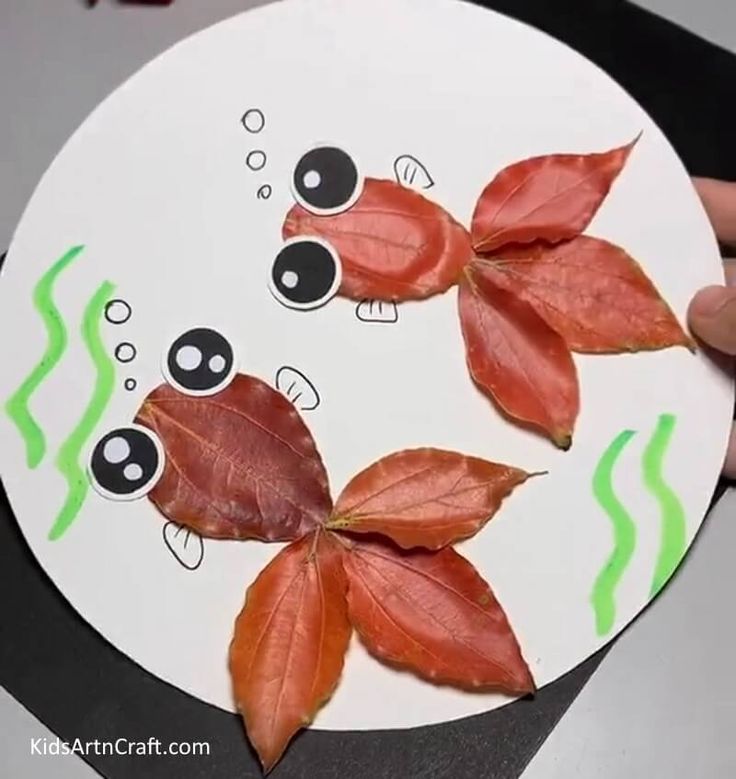 a paper plate with some leaves on it