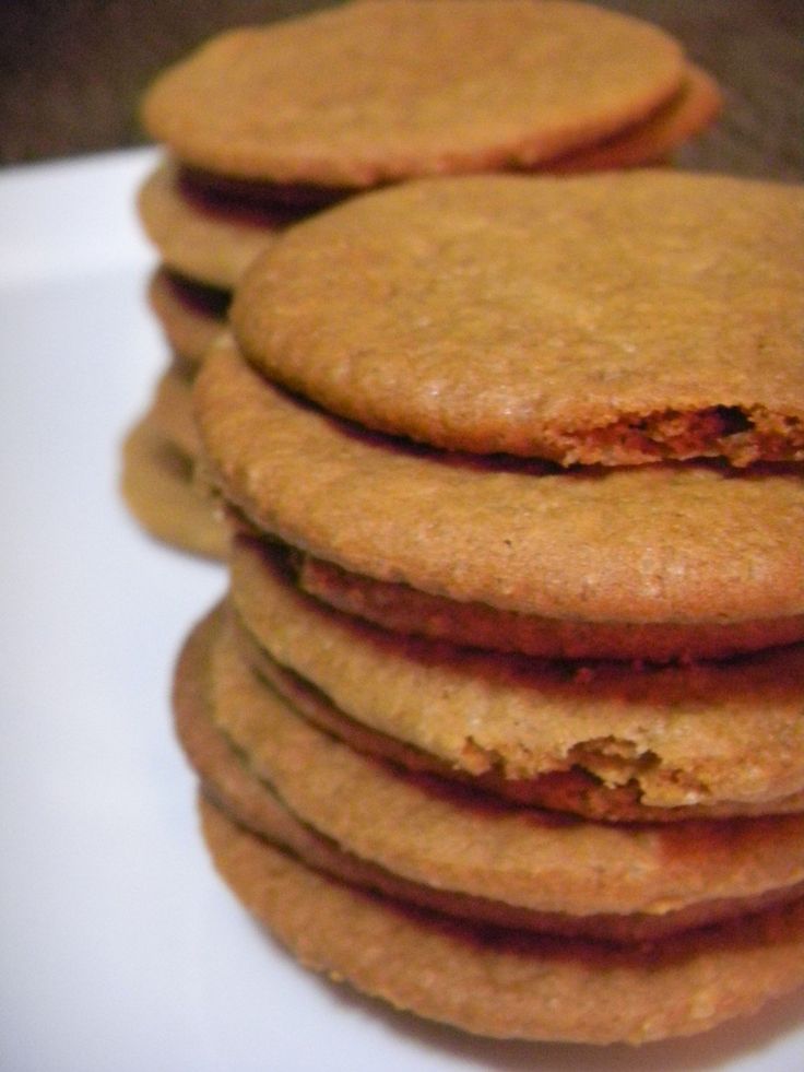 a stack of cookies sitting on top of a white plate