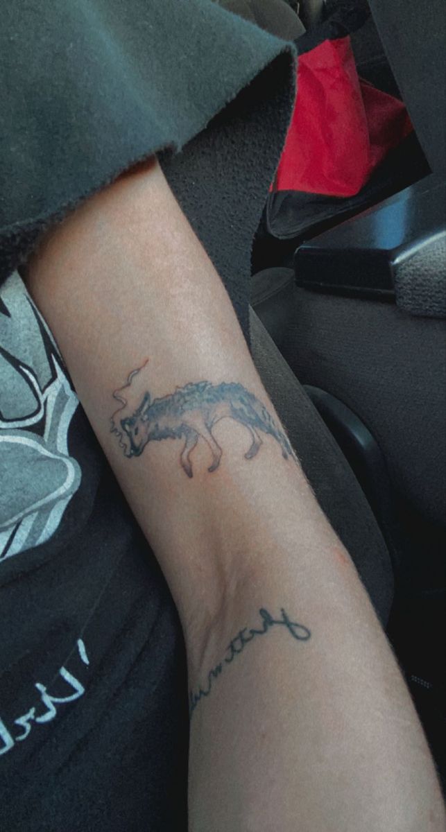 a person with a tattoo on their arm