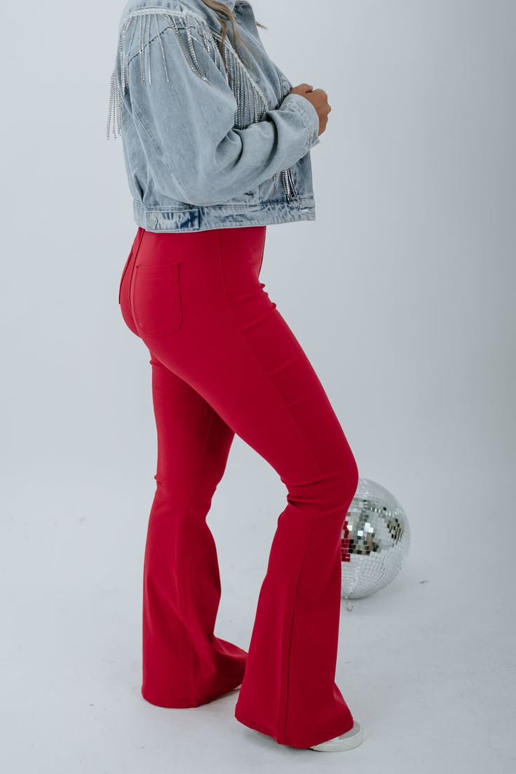 These show-stopping cherry red flares are made for those days when plain blue jeans just simply won't cut it. Gorgeous and ready to take the town! Ultra High Rise Fabric: 76% Cotton, 20% Polyester, 4% Spandex Details: Two back pocket design, button closure with zipper fly, ultra comfortable, breathable fabrication. Imported Fit: True to size- Ultra high rise- If you are in between sizes, size down Inseam: 31" Model Specs: Emily is wearing a size small in the photo. How will this item fit you? Ch Fall Flare Jeans For Night Out, Trendy Flares For Night Out In Fall, Spring Flare Jeans For Night Out, Casual Flares For Night Out In Spring, Trendy Red Full-length Jeans, Red High Waist Flare Jeans For Spring, Red Full-length Jeans For Spring, Chic Red High Waist Jeans, Chic Red High-waist Jeans